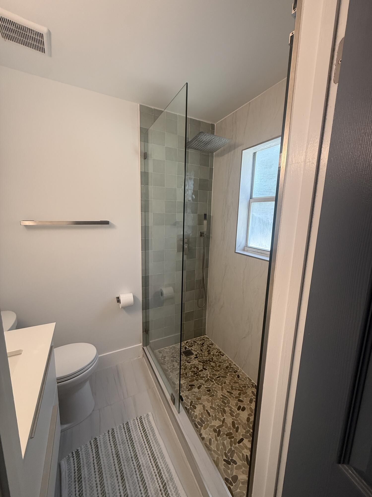 972 Jeffery Street Boca Raton, FL 33487 - Photo 8 of 16 a bathroom with a sink and toilet