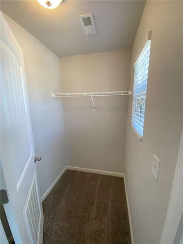 a view of small space with racks on the wall