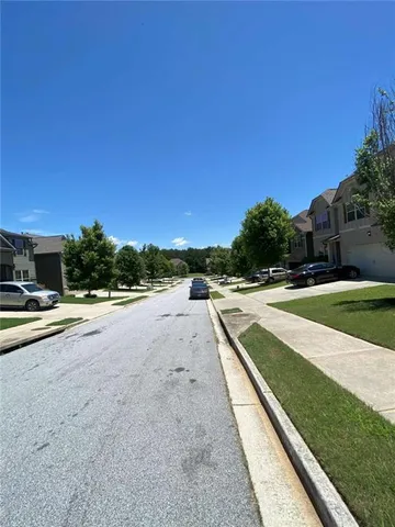 a view of swimming pool with a yard