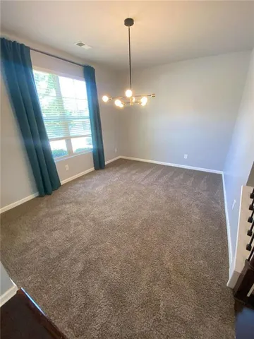 a view of a room with a sink and window