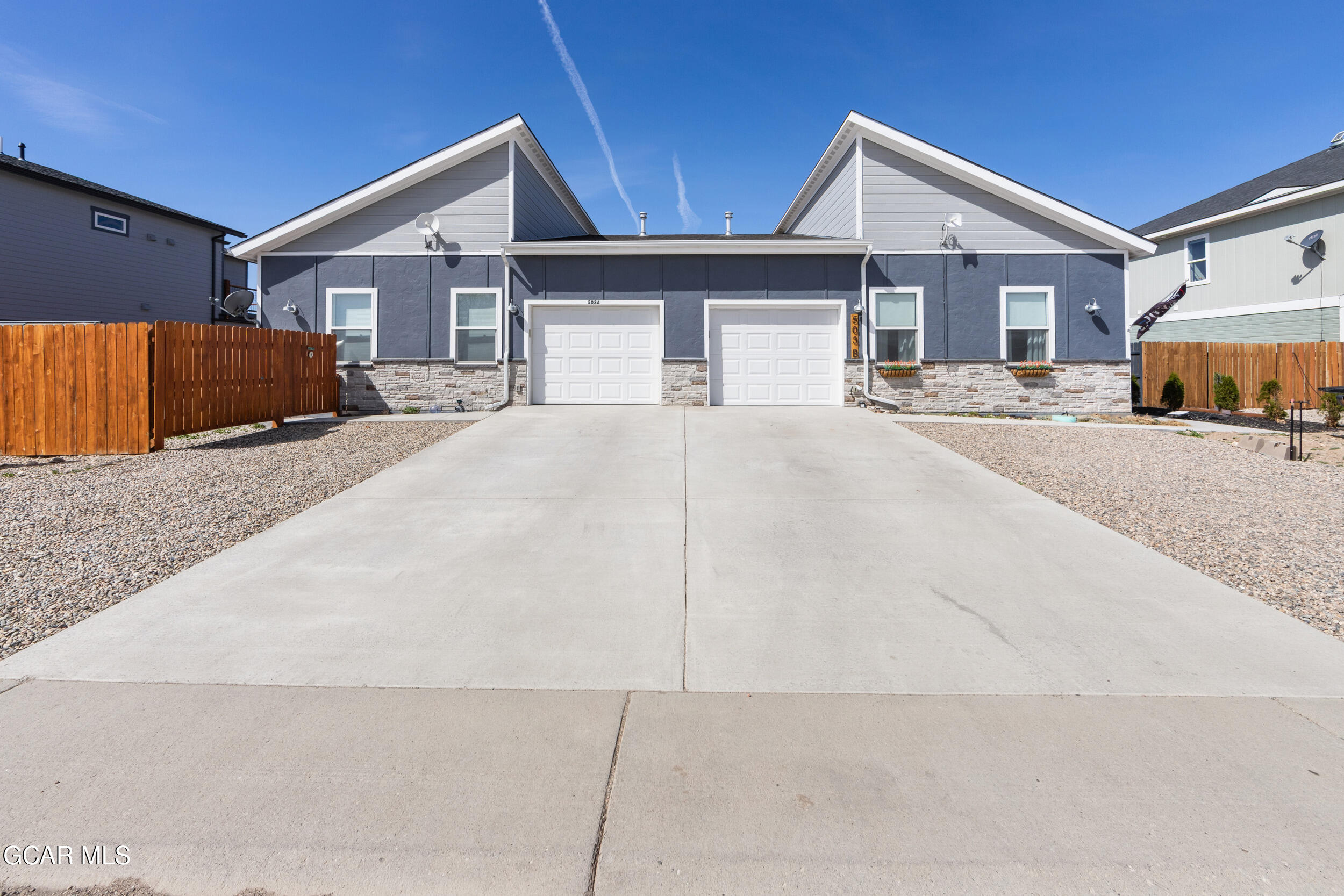 503 12th Street, Unit B Kremmling, CO 80459 - Photo 40 of 44 a big house with a big yard and large parking space
