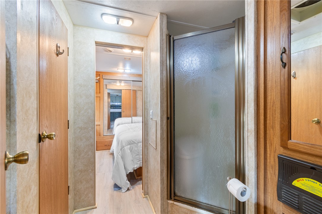 7945 Lake Road, Unit 86 Sodus, NY 14555 - Photo 17 of 22 Walk in shower is adjacent to the bedroom