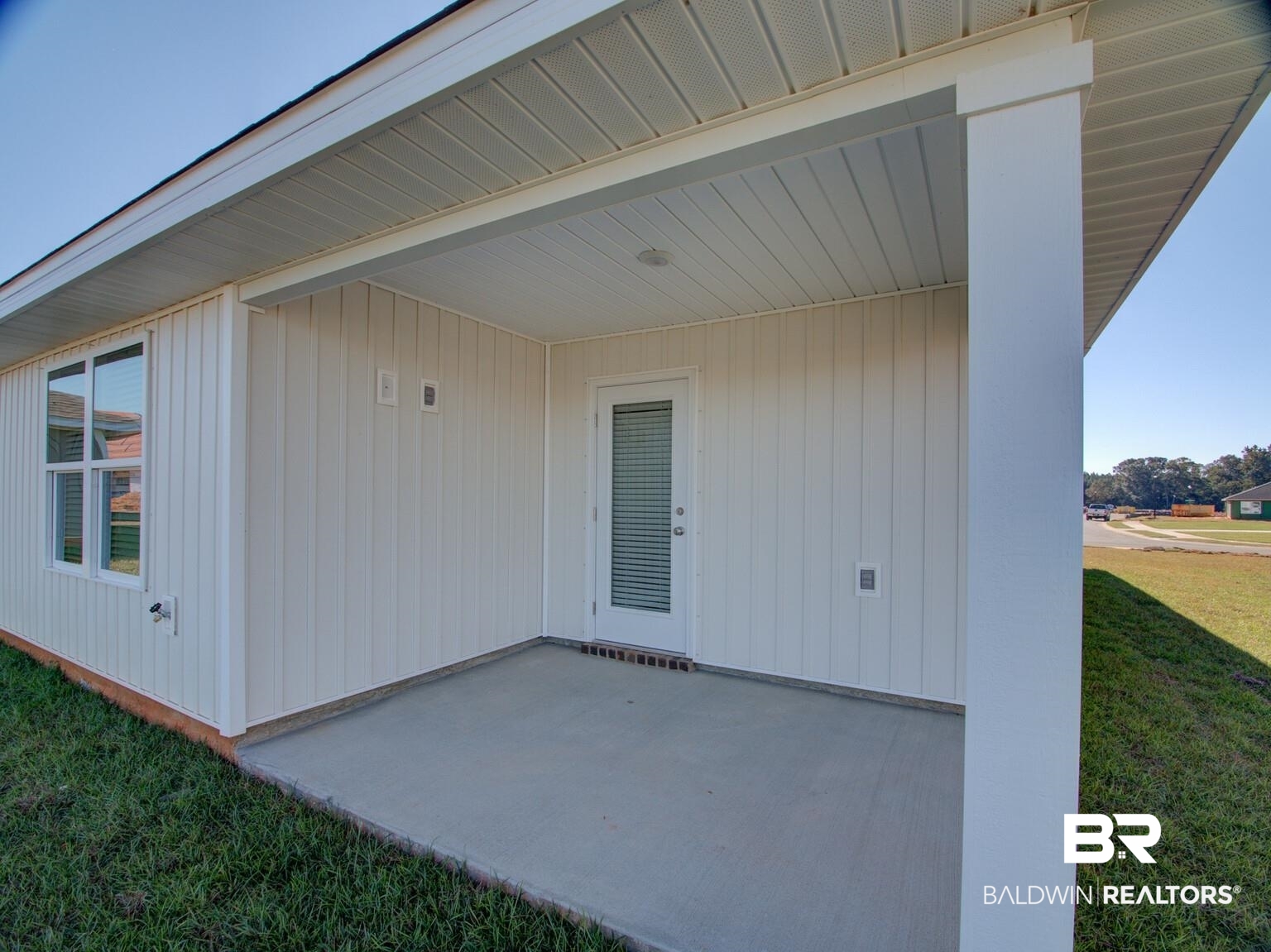 23952 Citation Loop Daphne, AL 36526 - Photo 36 of 69 View of exterior entry with a lawn