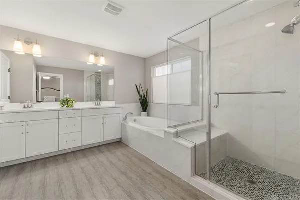 a white bath tub sitting in a bathroom