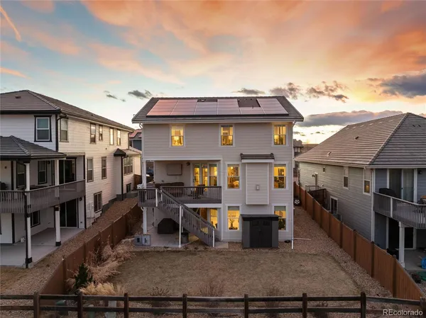 a view of a house with wooden deck