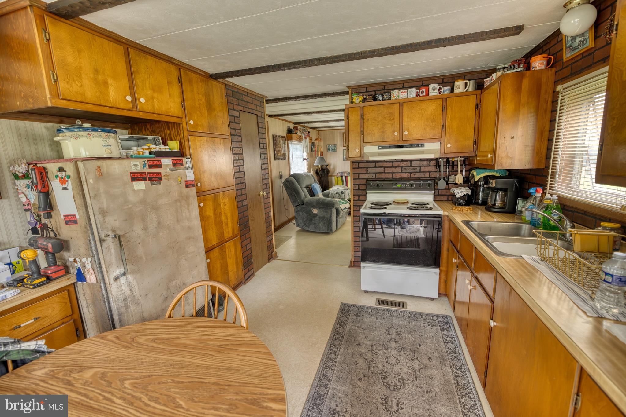 158 C Pleasant View Road Halifax, PA 17032 - Photo 19 of 59 a kitchen with sink refrigerator and cabinets