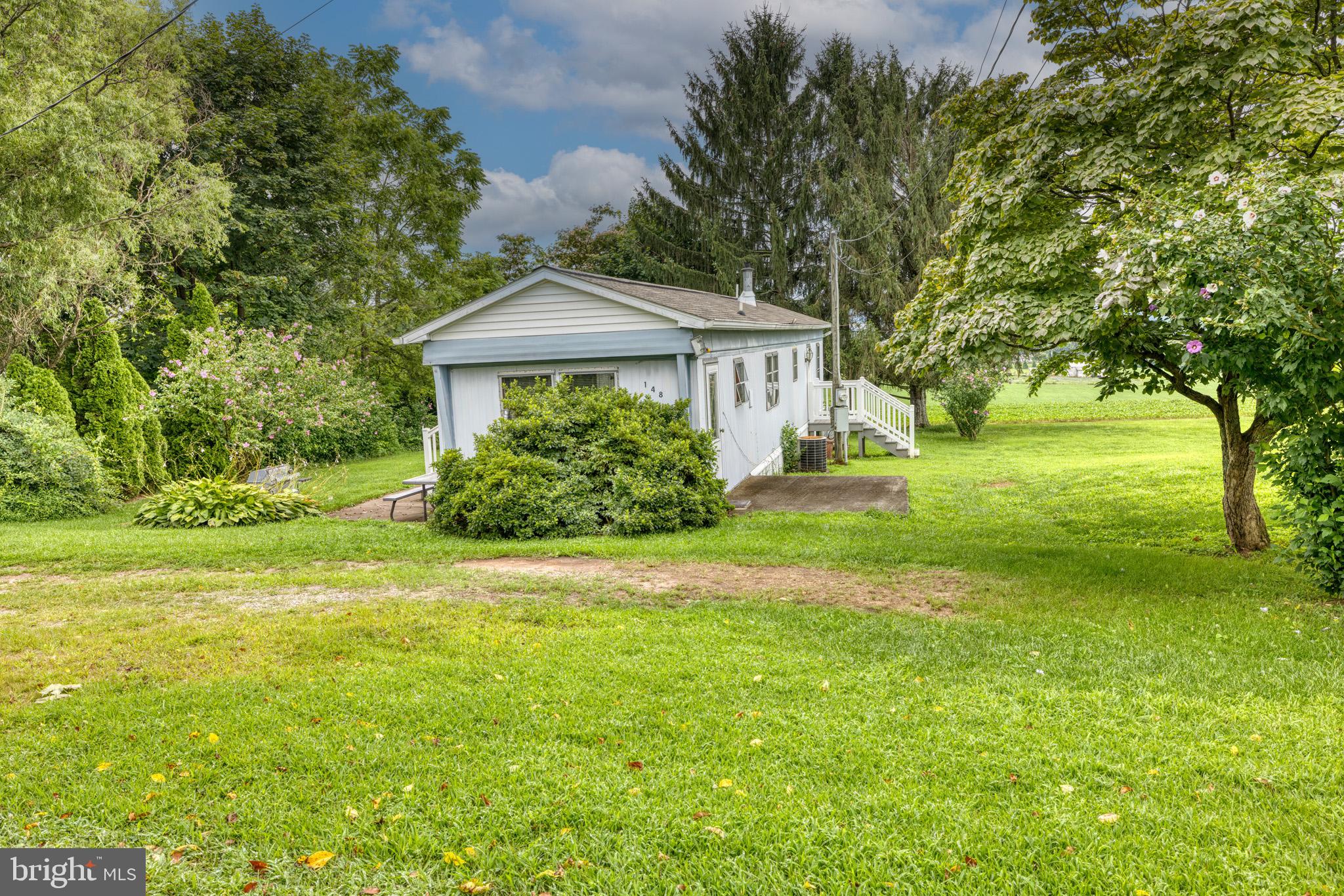 158 C Pleasant View Road Halifax, PA 17032 - Photo 26 of 59 a front view of a house with yard and green space