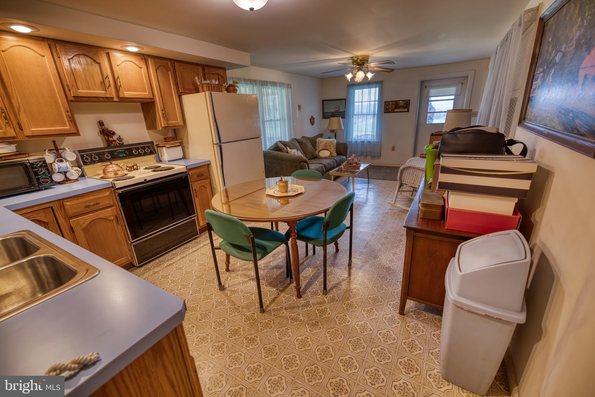 158 C Pleasant View Road Halifax, PA 17032 - Photo 34 of 59 a living room with furniture a flat screen tv and a refrigerator