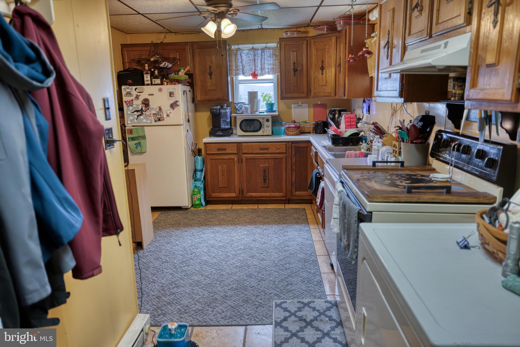 158 C Pleasant View Road Halifax, PA 17032 - Photo 4 of 59 a kitchen with refrigerator and stove