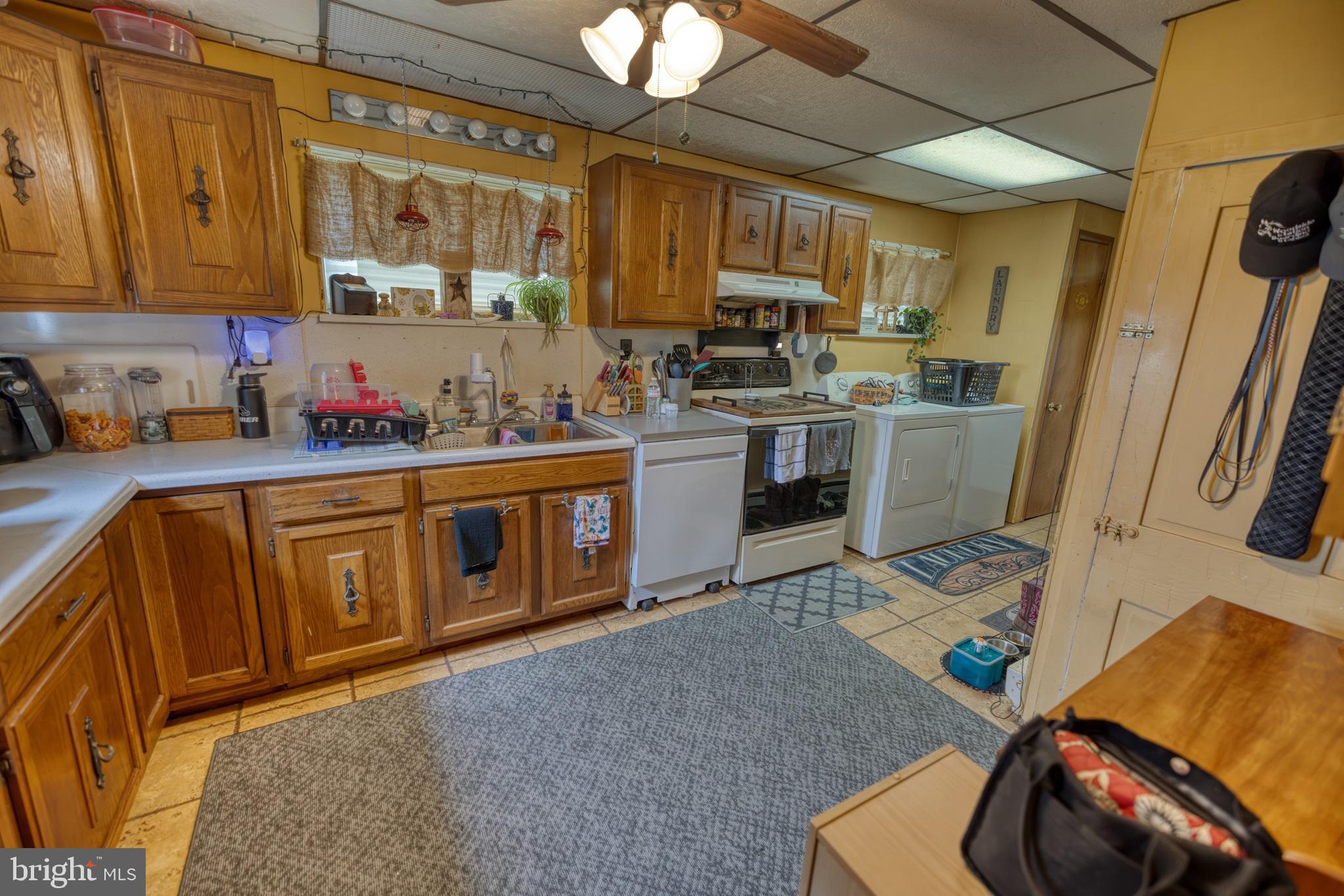 158 C Pleasant View Road Halifax, PA 17032 - Photo 5 of 59 a kitchen with sink refrigerator and cabinets