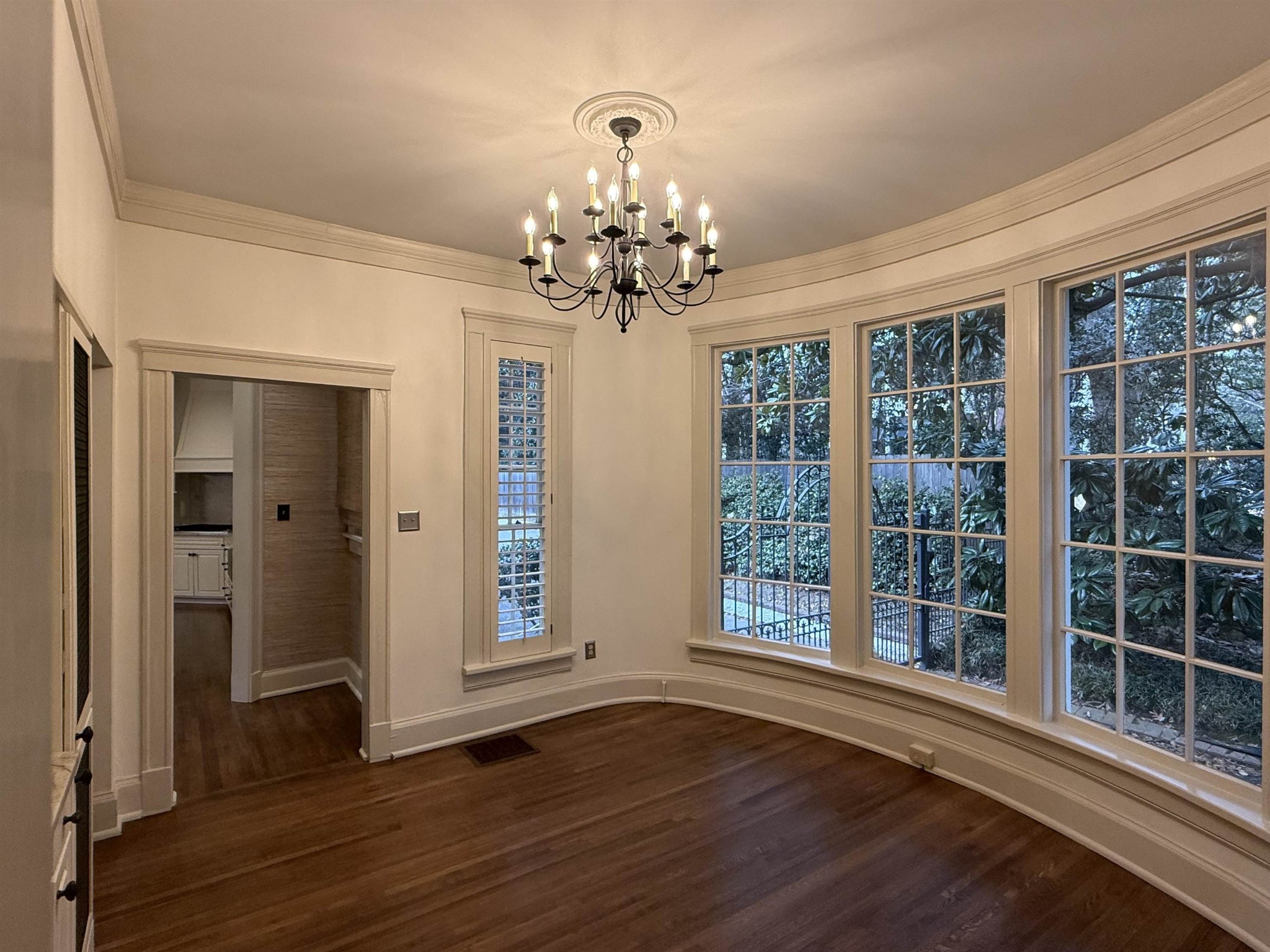 505 Goodwyn Street Memphis, TN 38111 - Photo 11 of 40 a view of an empty room with wooden floor and a window