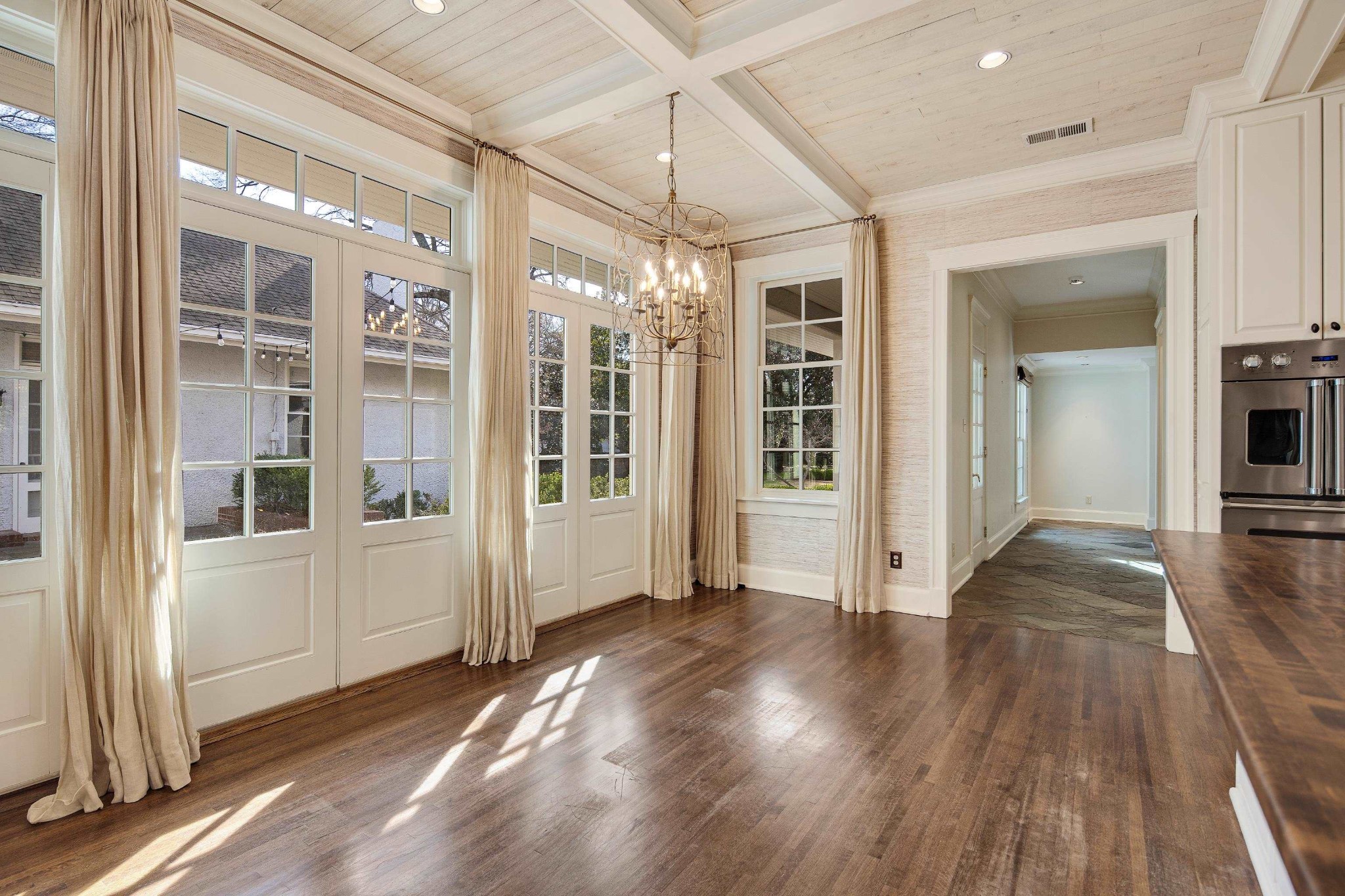 505 Goodwyn Street Memphis, TN 38111 - Photo 15 of 40 an empty room with wooden floor and windows