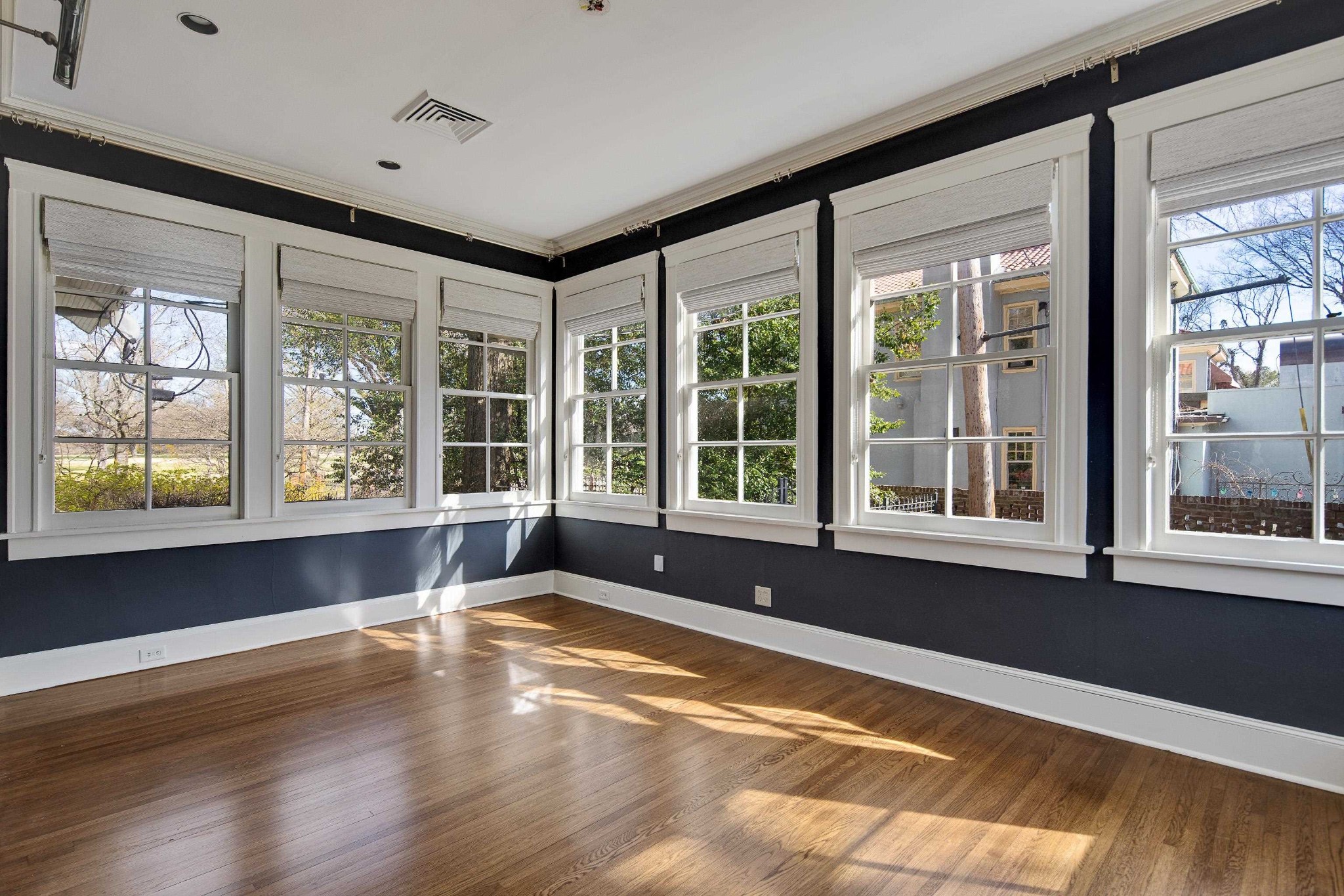 505 Goodwyn Street Memphis, TN 38111 - Photo 22 of 40 a view of an empty room with wooden floor and a window