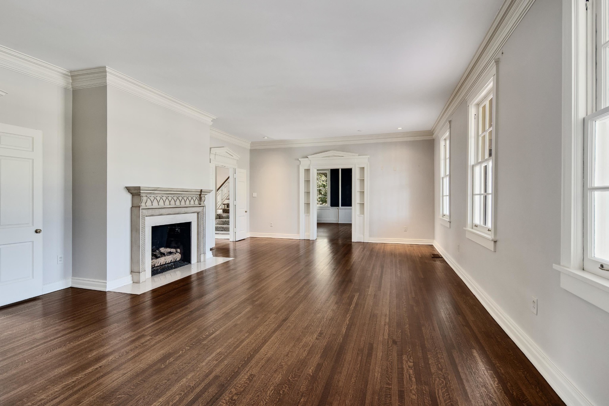 505 Goodwyn Street Memphis, TN 38111 - Photo 6 of 40 a view of a livingroom with wooden floor and a fireplace