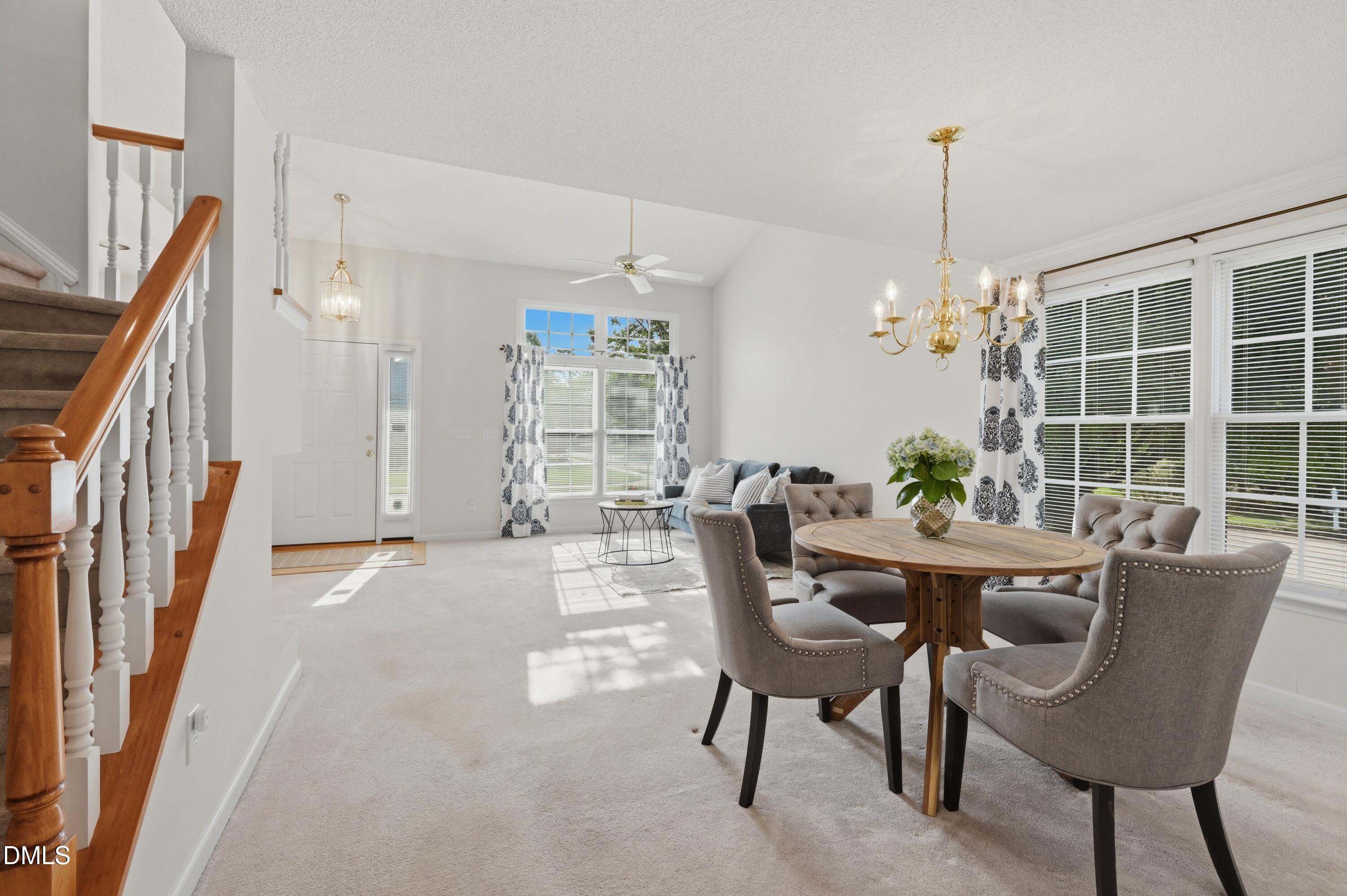 6801 Lynnoak Drive Raleigh, NC 27613 - Photo 7 of 30 a view of a dining room with furniture window and wooden floor