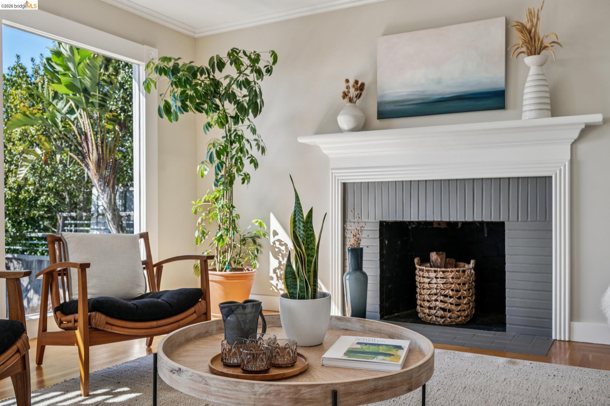 290 Colgate Avenue Kensington, CA 94708 - Photo 12 of 52 Sitting room featuring wood finished floors, a brick fireplace, and crown molding