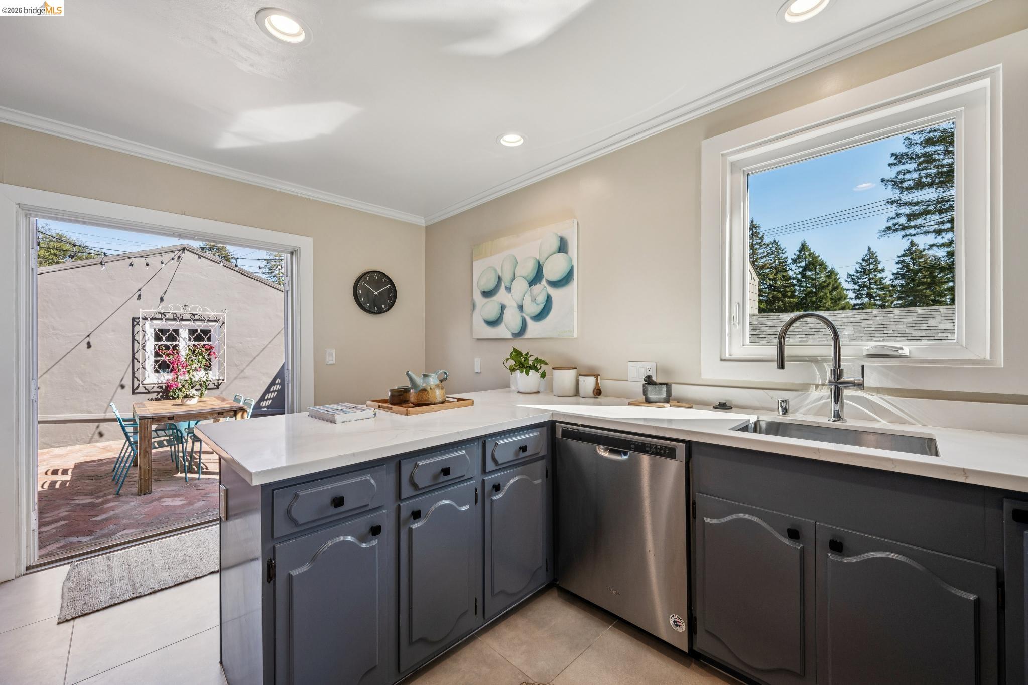 290 Colgate Avenue Kensington, CA 94708 - Photo 28 of 52 Kitchen with a peninsula, stainless steel dishwasher, recessed lighting, crown molding, and gray cabinets