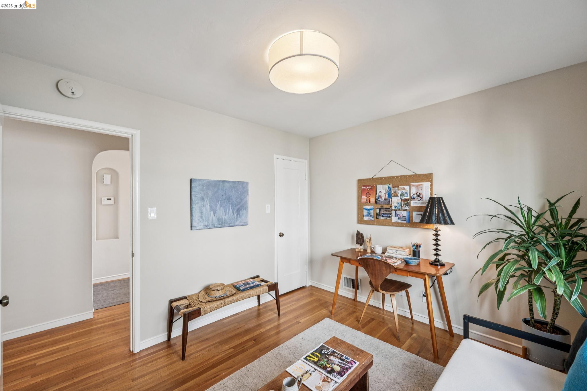 290 Colgate Avenue Kensington, CA 94708 - Photo 38 of 52 Sitting room with wood finished floors, a desk, and arched walkways