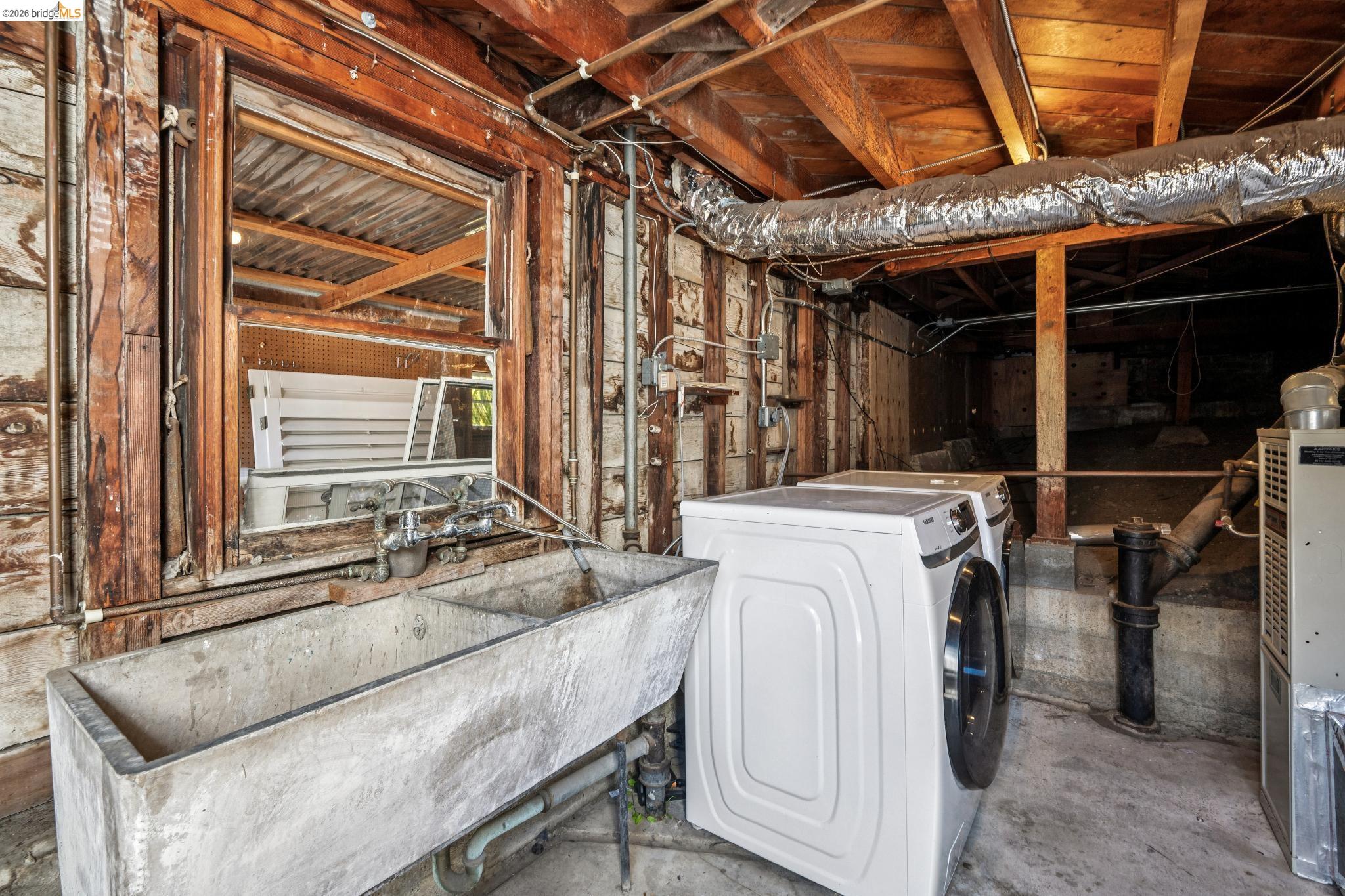 290 Colgate Avenue Kensington, CA 94708 - Photo 39 of 52 Unfinished basement featuring a sink and heating unit