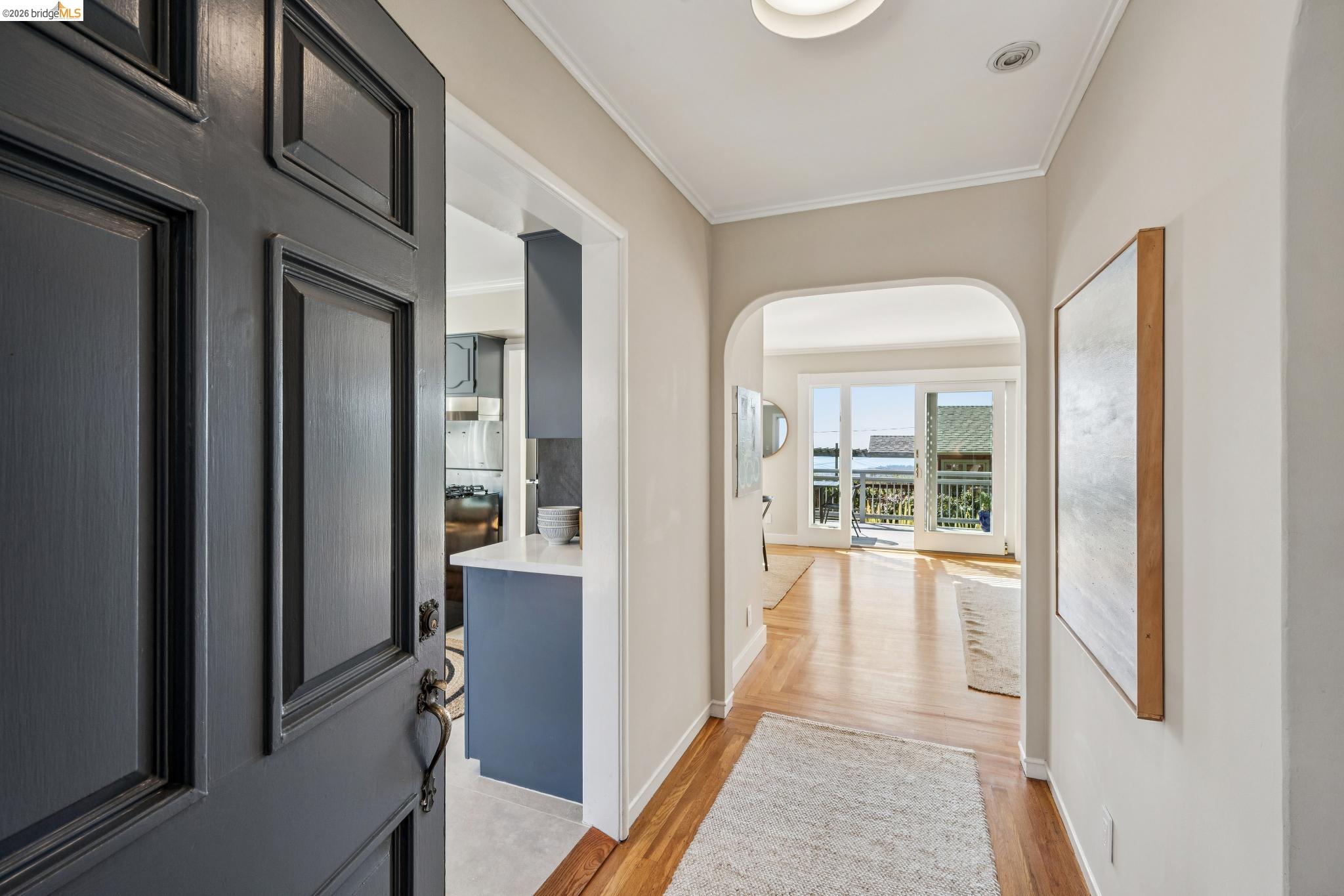 290 Colgate Avenue Kensington, CA 94708 - Photo 6 of 52 Corridor featuring ornamental molding, light wood-style flooring, and arched walkways