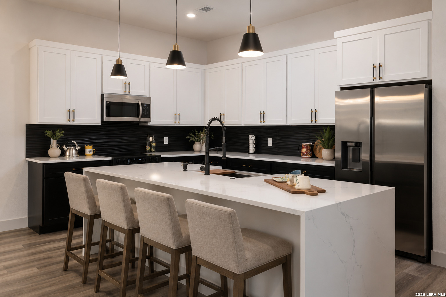 1210 Fernwood Road Fischer, TX 78623 - Photo 20 of 36 a kitchen with kitchen island granite countertop a sink a center island and stainless steel appliances
