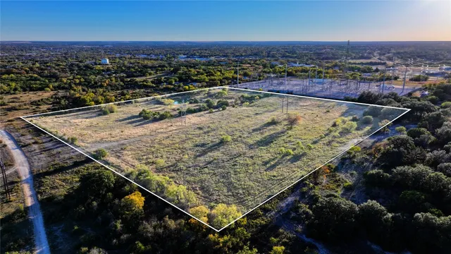 an aerial view of a residential apartment building in front of it