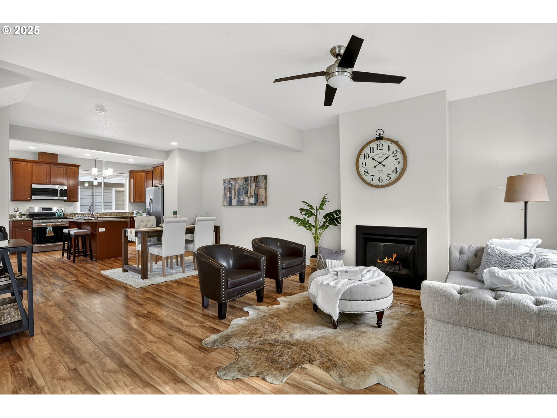 464 Northeast 3rd Avenue Canby, OR 97013 - Photo 13 of 28 a living room with furniture and a fireplace