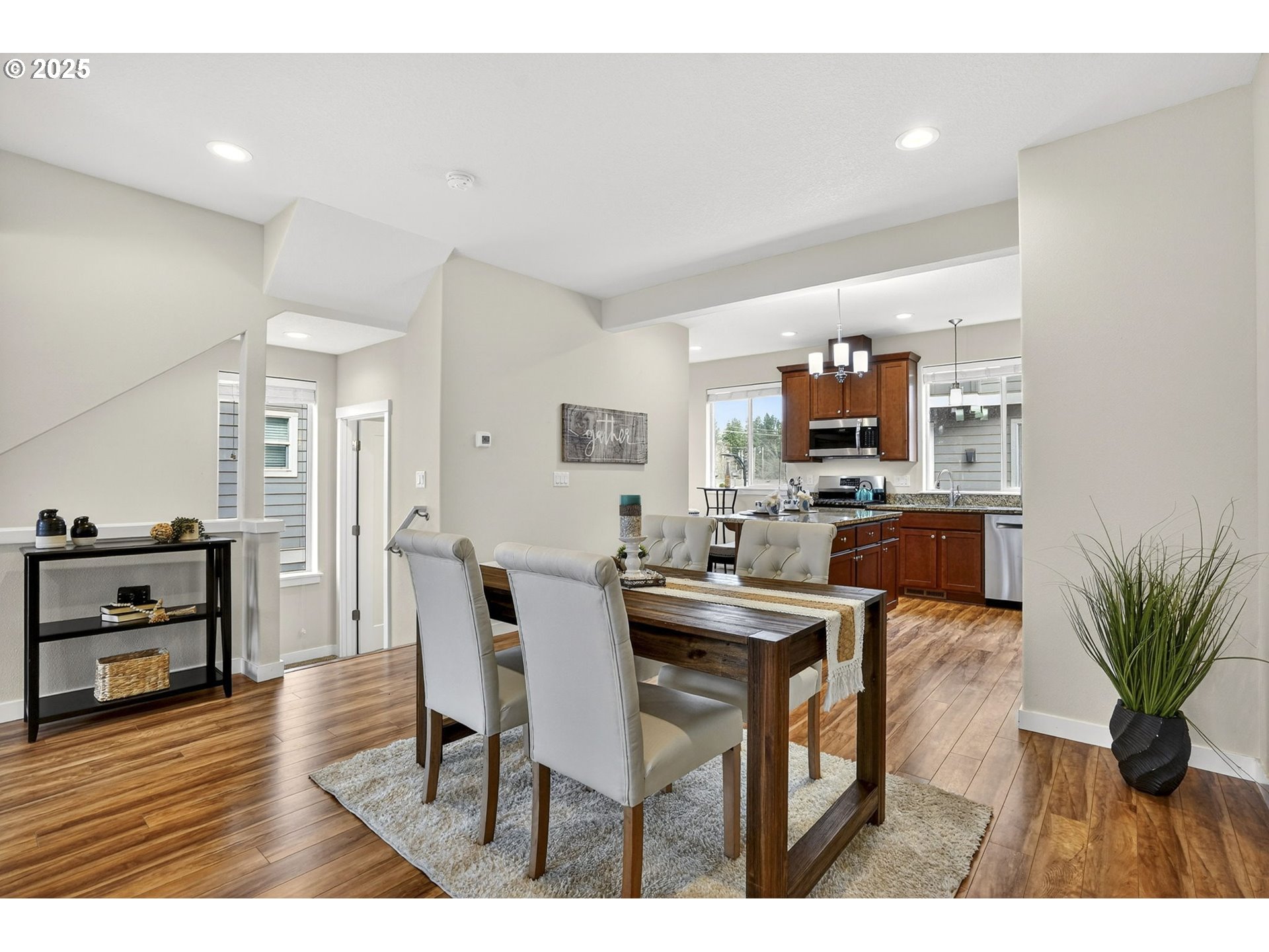 464 Northeast 3rd Avenue Canby, OR 97013 - Photo 7 of 28 a view of a dining room kitchen with furniture and wooden floor