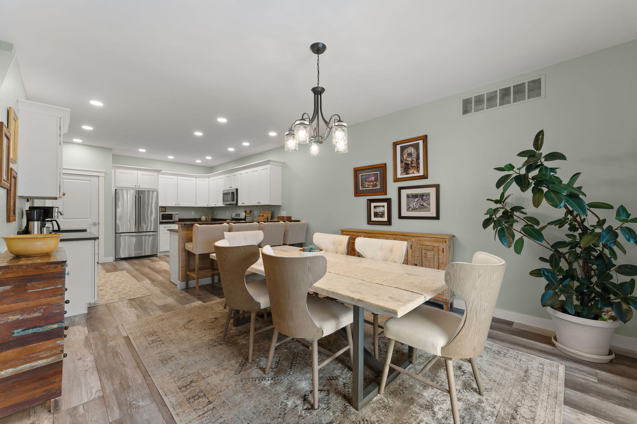 4200 Cardinal Lane Valparaiso, IN 46383 - Photo 10 of 44 a view of a dining room with furniture and a potted plant