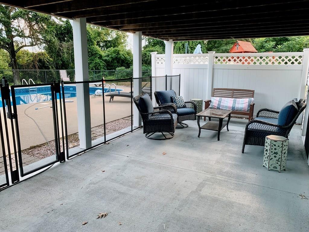 254 Mendon Road Sutton, MA 01590 - Photo 35 of 36 a view of a patio with a table and chairs