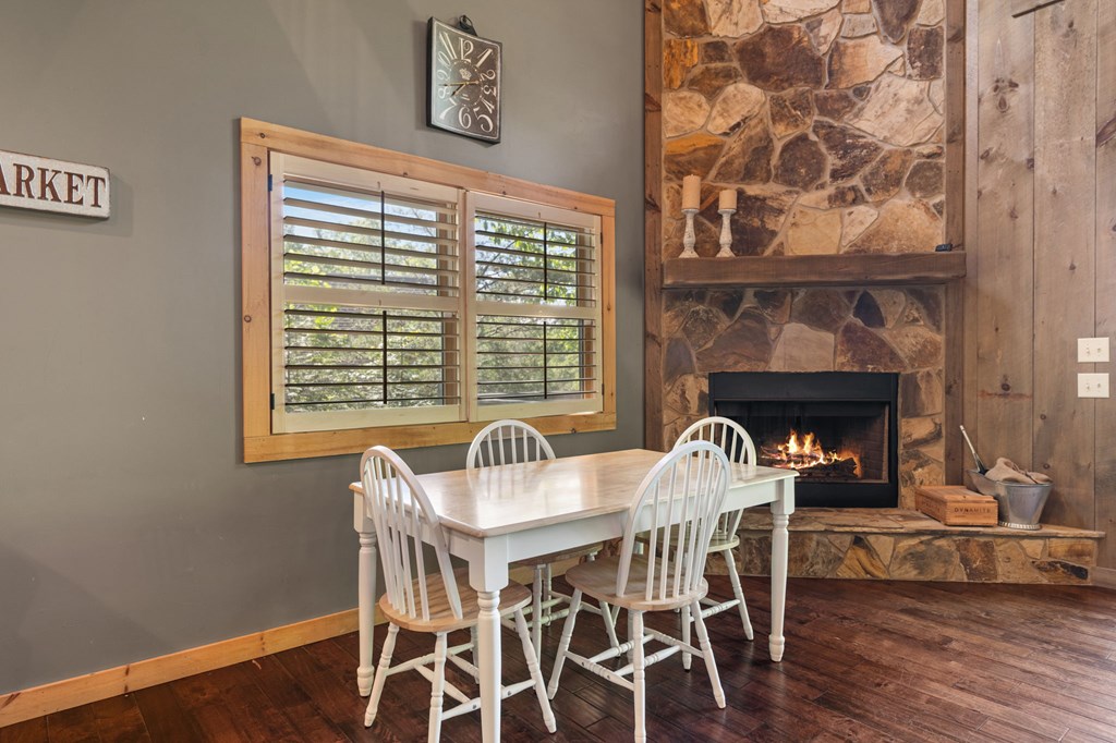 479 Big Timber Road Mineral Bluff, GA 30559 - Photo 14 of 60 a dining room with furniture and wooden floor