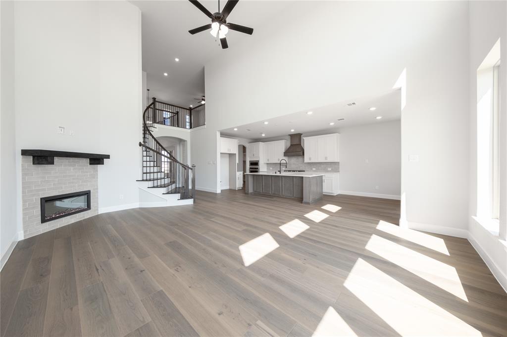 3307 Guardian Angel Court Heath, TX 75126 - Photo 10 of 40 a view of a living room a fireplace with wooden floor