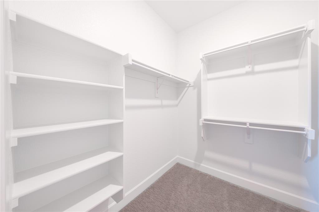 3307 Guardian Angel Court Heath, TX 75126 - Photo 16 of 40 a view of an empty walk in closet