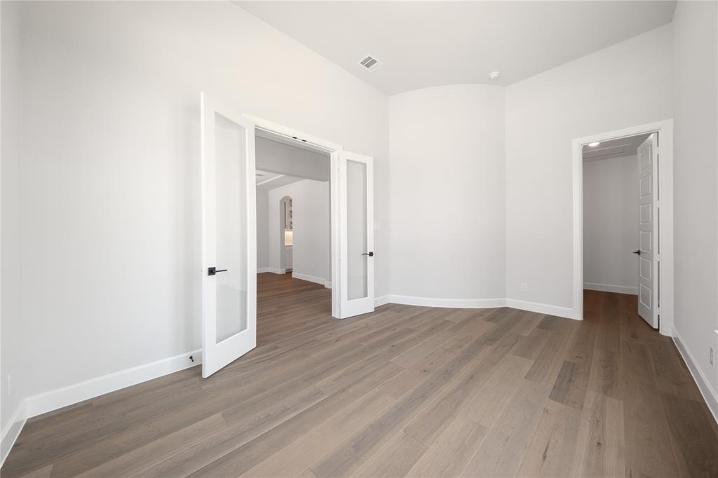 3307 Guardian Angel Court Heath, TX 75126 - Photo 18 of 40 an empty room with wooden floor & closet area