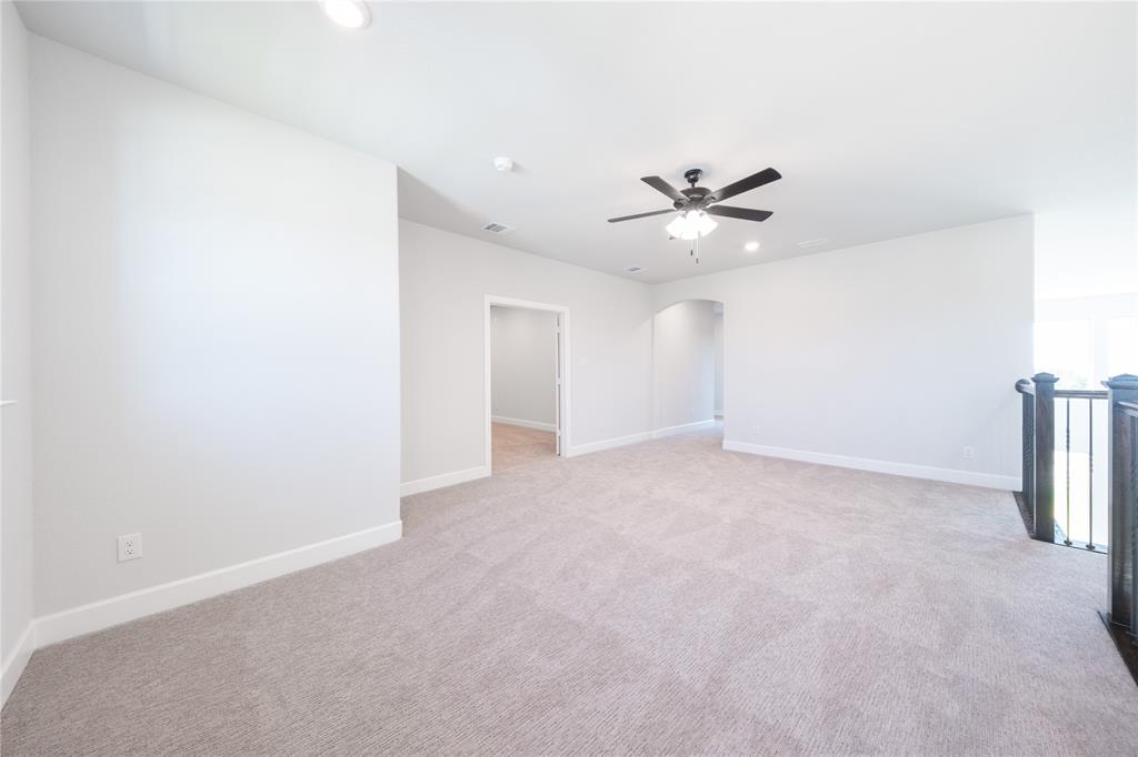 3307 Guardian Angel Court Heath, TX 75126 - Photo 20 of 40 an empty room with fan and a ceiling fan