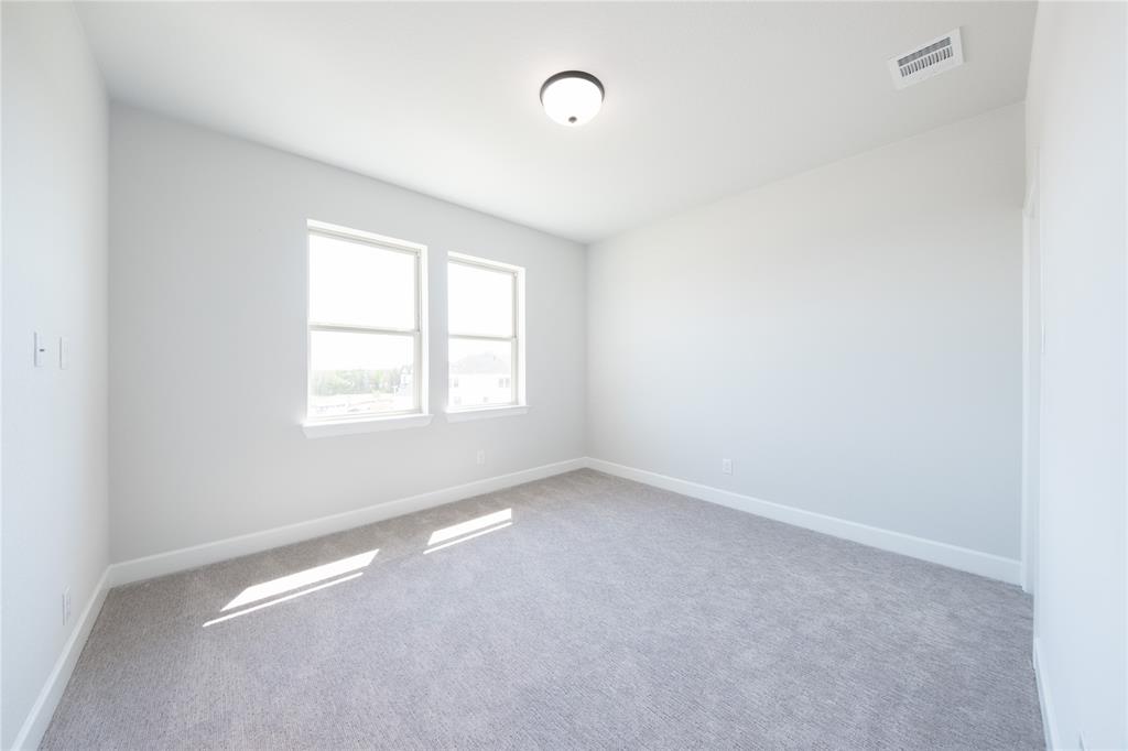 3307 Guardian Angel Court Heath, TX 75126 - Photo 23 of 40 an empty room with windows