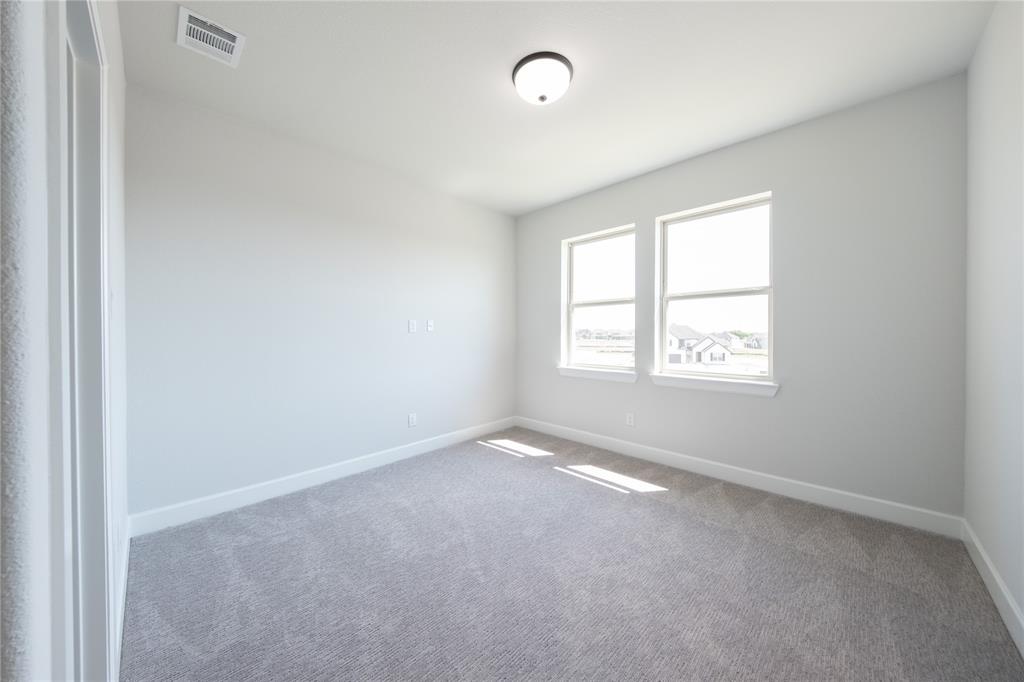 3307 Guardian Angel Court Heath, TX 75126 - Photo 26 of 40 an empty room with windows
