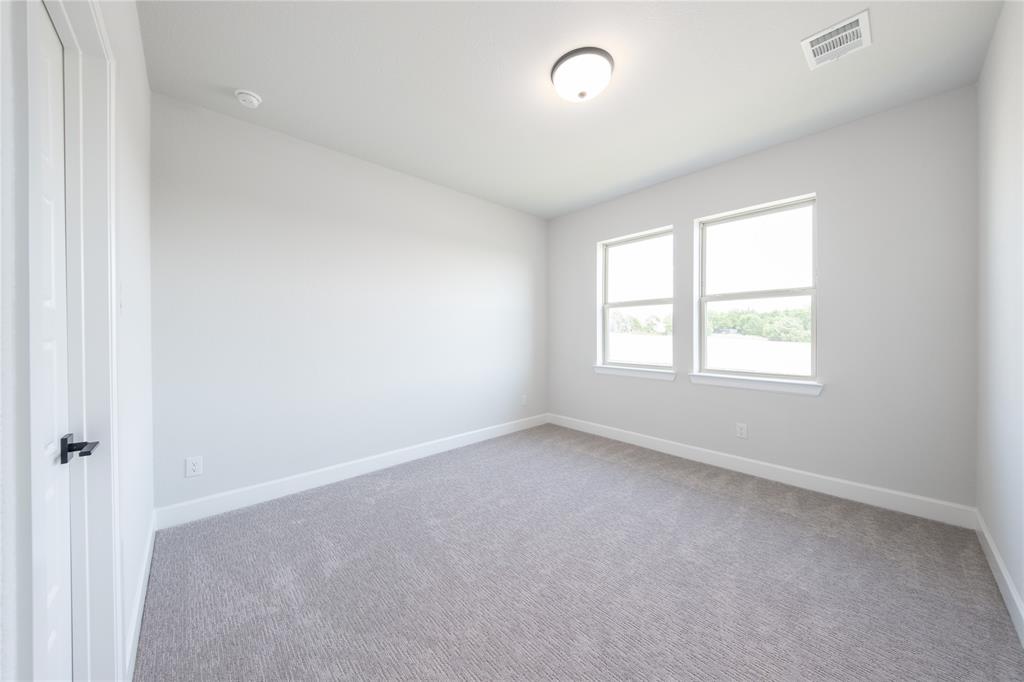 3307 Guardian Angel Court Heath, TX 75126 - Photo 29 of 40 an empty room with a window