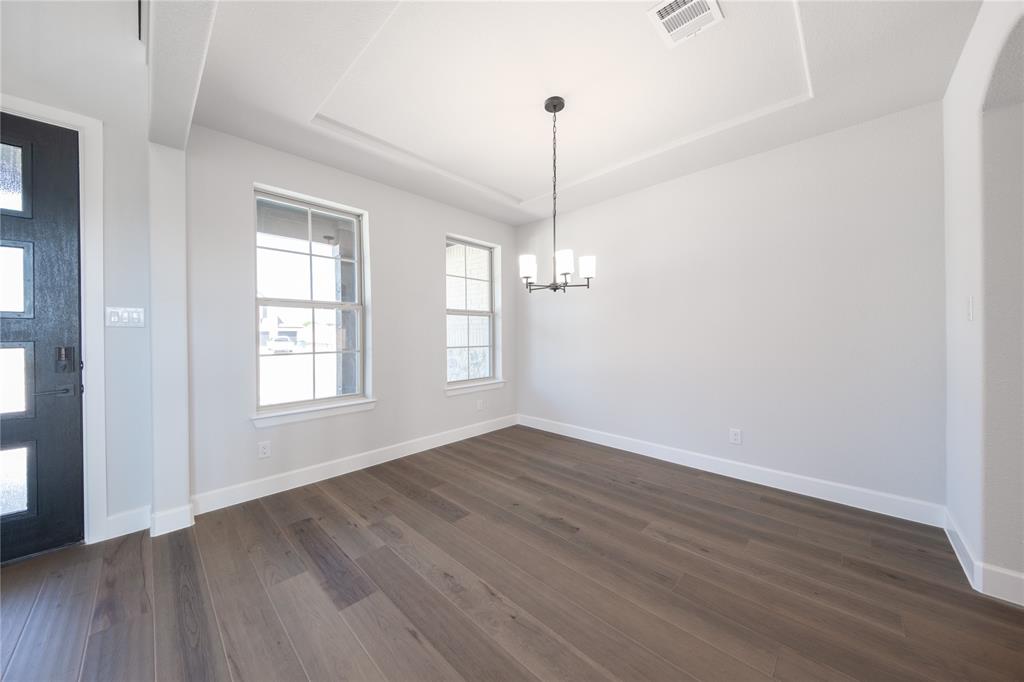 3307 Guardian Angel Court Heath, TX 75126 - Photo 6 of 40 a view of empty room with wooden floor and windows