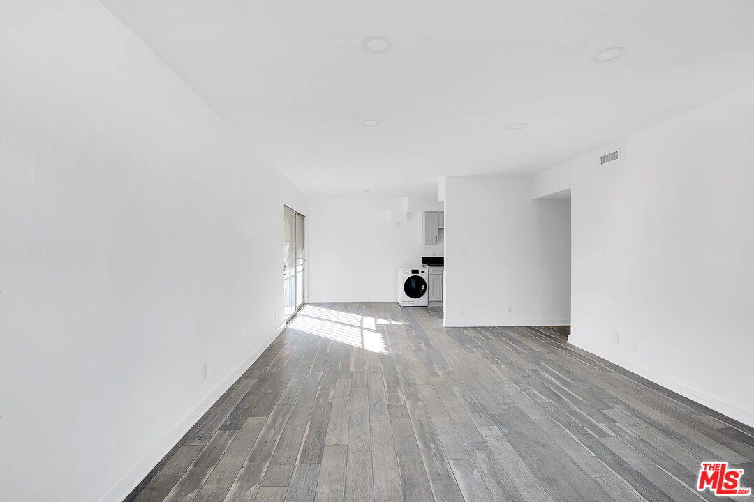 1610 South Beverly Glen Boulevard, Unit 6 Los Angeles, CA 90024 - Photo 6 of 16 a view of an empty room with wooden floor