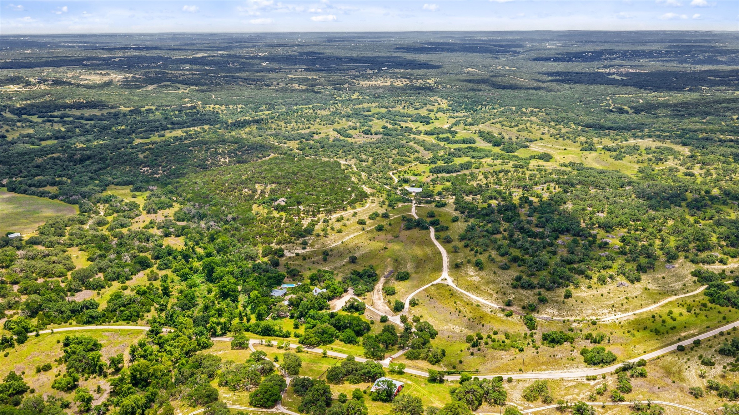 505 Red Corral Ranch Road Wimberley, TX 78676 - Photo 2 of 40 Sprawling acreage with a private road system offers ultimate seclusion and breathtaking natural scenery.