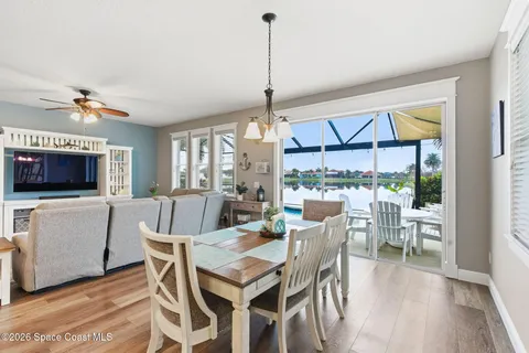 a view of a dining room with furniture window and wooden floor