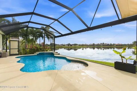 a view of a swimming pool with an outdoor seating