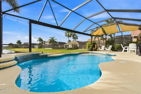 a view of a swimming pool with a patio