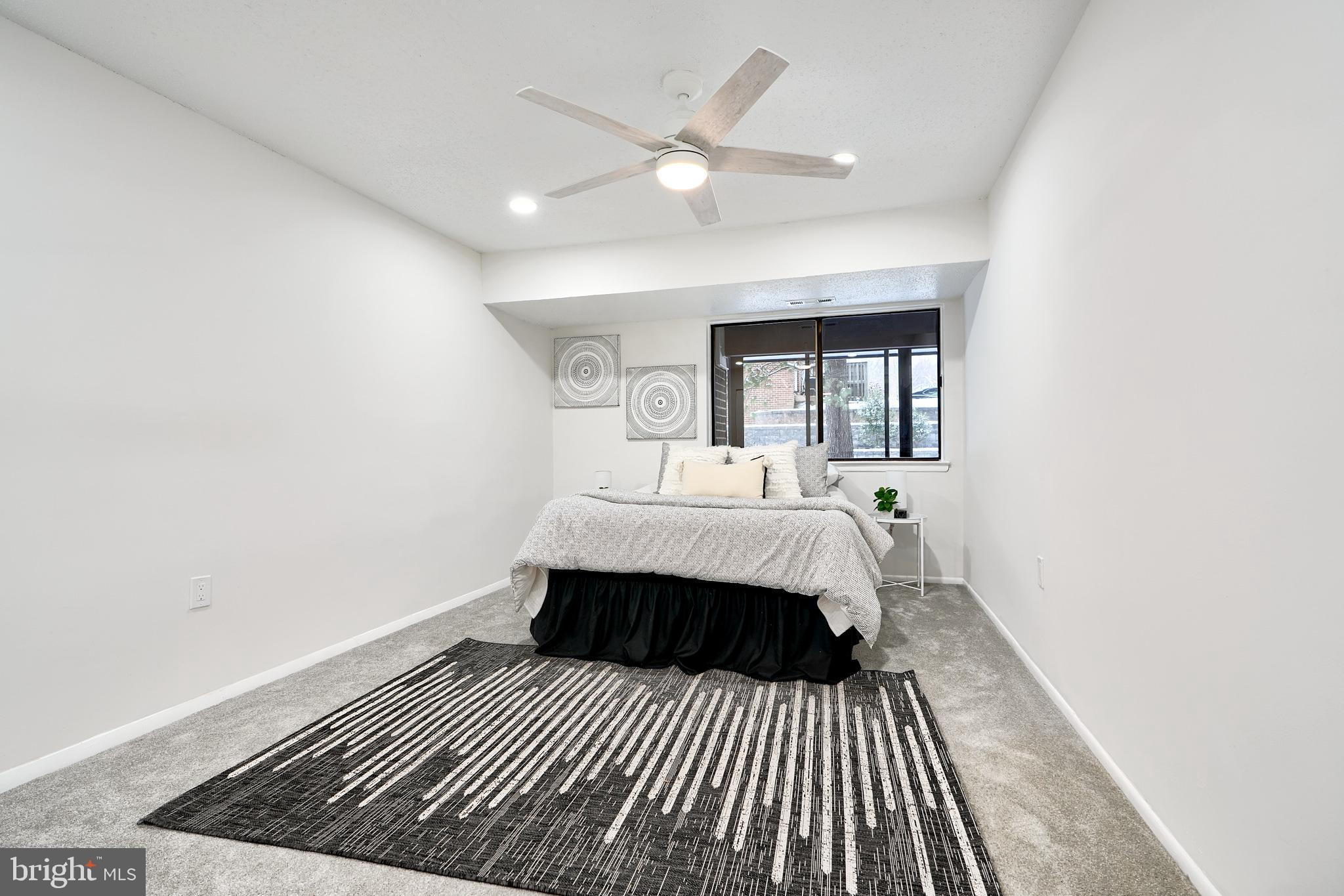 6 Longstream Court, Unit T1 Baltimore, MD 21209 - Photo 13 of 25 a bedroom with a bed and a window