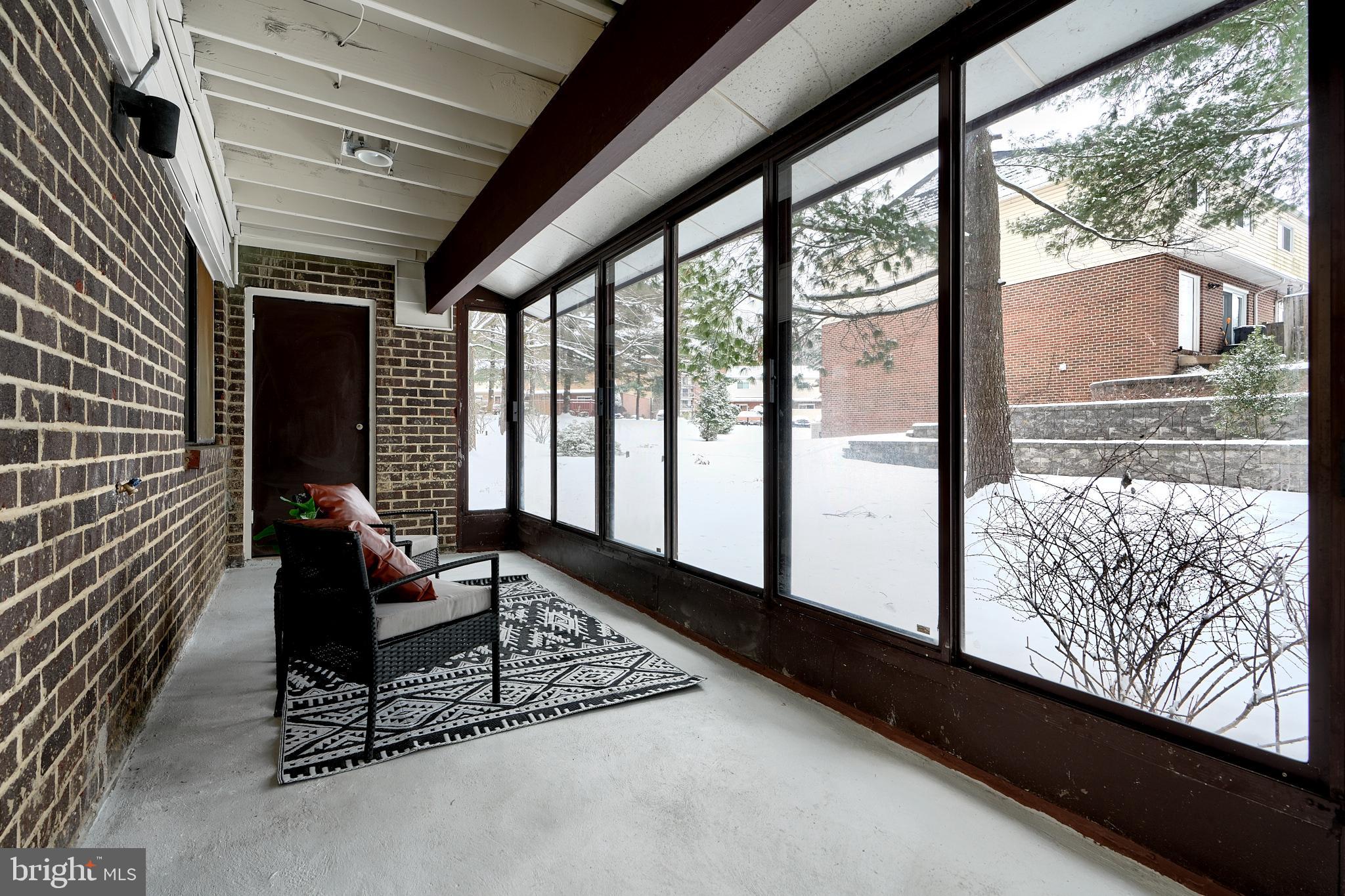 6 Longstream Court, Unit T1 Baltimore, MD 21209 - Photo 21 of 25 a living room with a large window