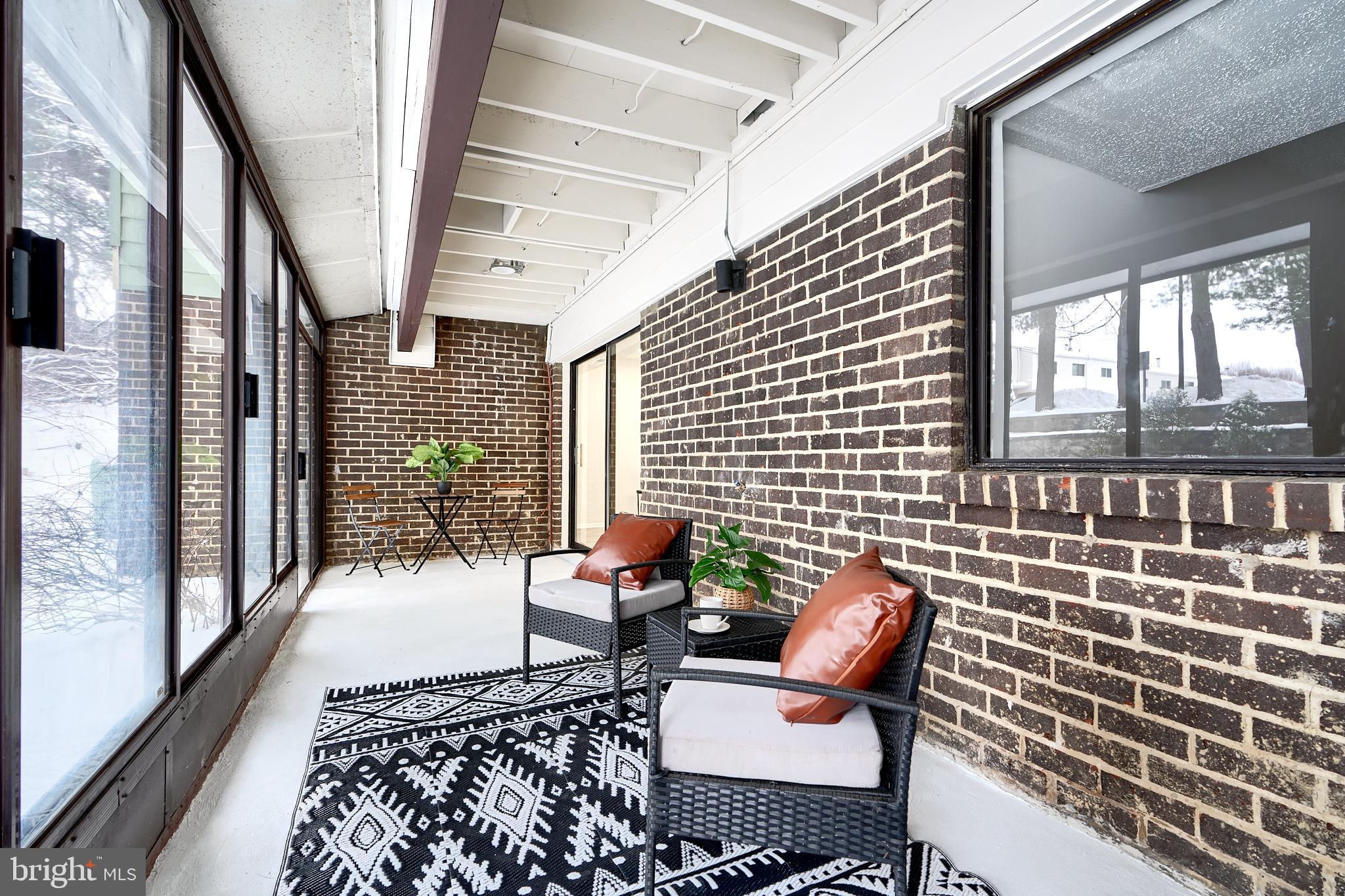 6 Longstream Court, Unit T1 Baltimore, MD 21209 - Photo 22 of 25 a bench sitting in front of a building