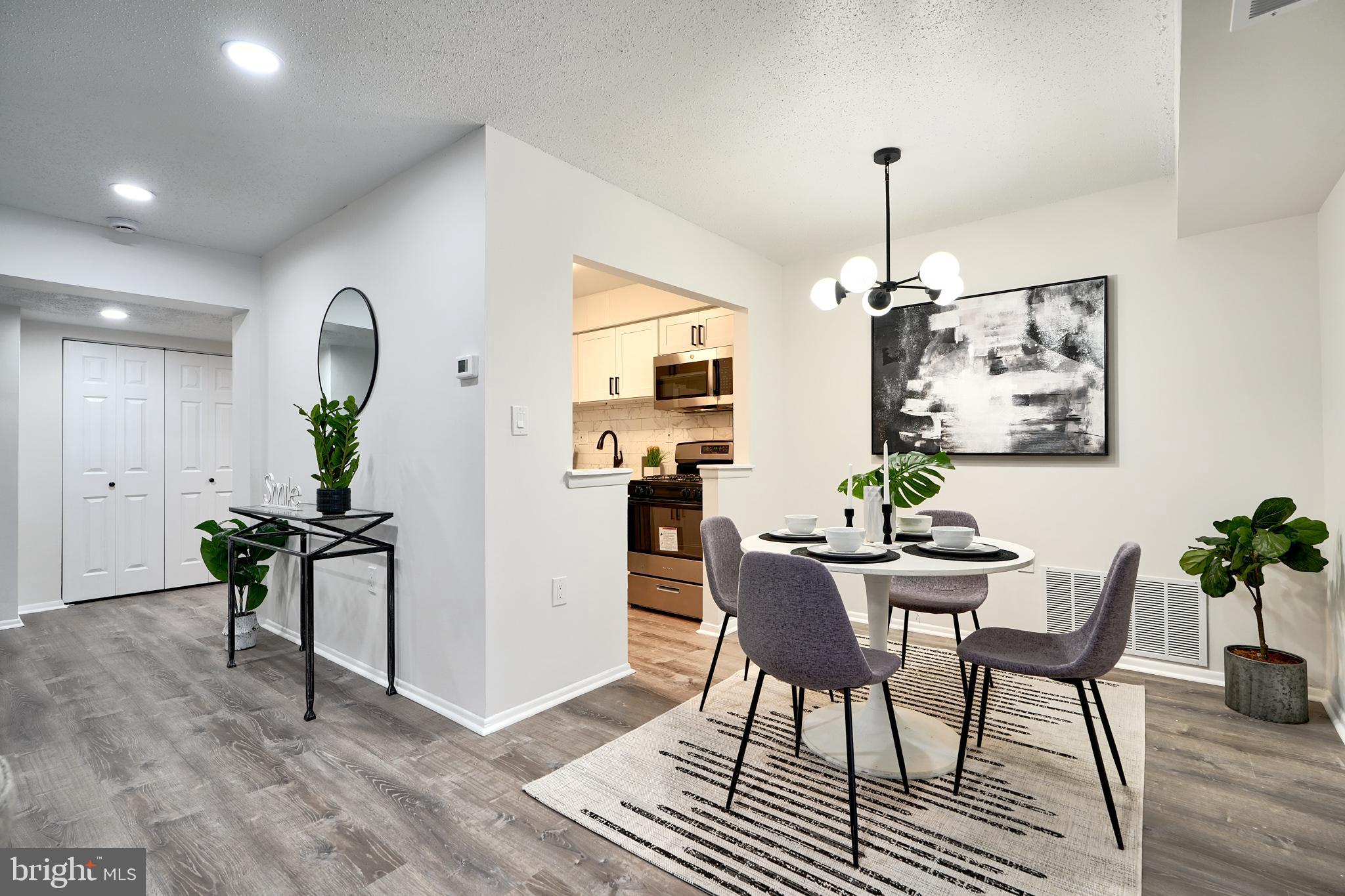 6 Longstream Court, Unit T1 Baltimore, MD 21209 - Photo 6 of 25 a view of a dining room with furniture