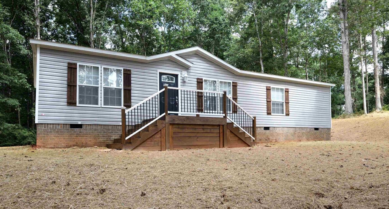 423 Ricky West Road Cleveland, GA 30528 - Photo 1 of 1 a front view of a house with a yard