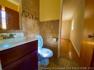 1416 Hibiscus Road Fayetteville, NC 28311 - Photo 13 of 16 a bathroom with a sink and a mirror